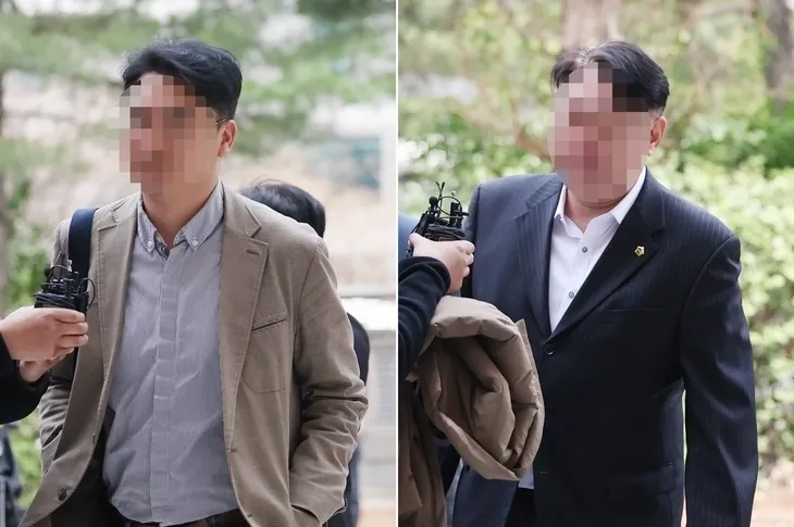 전자칠판 납품 사업과 관련해 업체 관계자들로부터 금품을 받은 혐의를 받는 현직 인천시의원 2명이 지난달 27일 오후 구속 전 피의자 심문(영장실질심사)을 받기 위해 인천지법으로 들어서고 있다. 연합뉴스