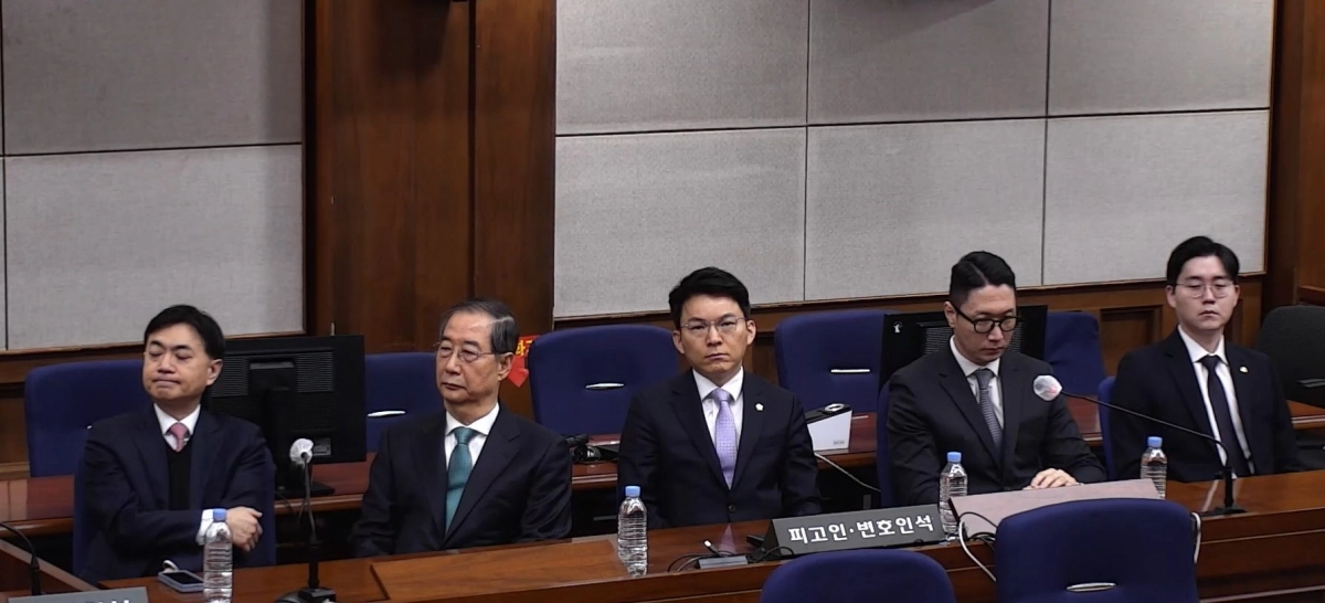 내란 중요임무 종사 혐의를 받는 한덕수 전 국무총리가 21일 서울중앙지법에서 열린 1심 선고 공판에 출석해 있다. 2026.1.21 서울중앙지법 제공