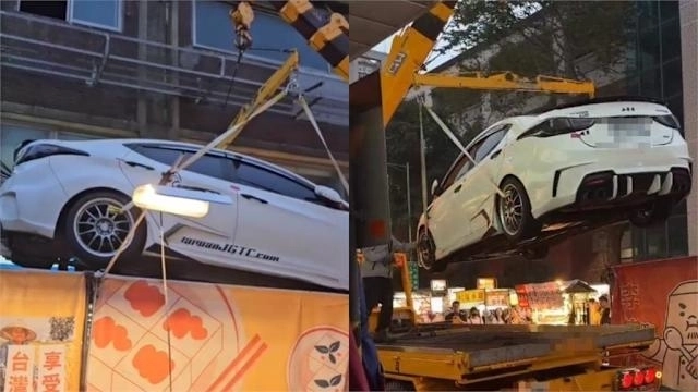 지난 29일 대만 타이베이의 관광 명소인 닝샤야시장에서 경찰이 야시장 한복판에 불법주차한 승용차를 크레인을 동원해 견인했다. 자료 : 스레드