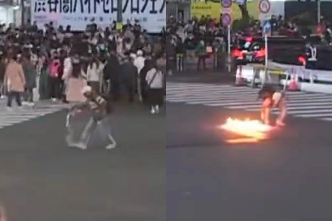 3일 밤 9시쯤 일본 도쿄 JR 시부야역 앞 스크램블 교차로에서 한 남성이 교차로 한복판에 휘발유를 붓고 불을 붙이고 있다. 엑스(X) 캡처