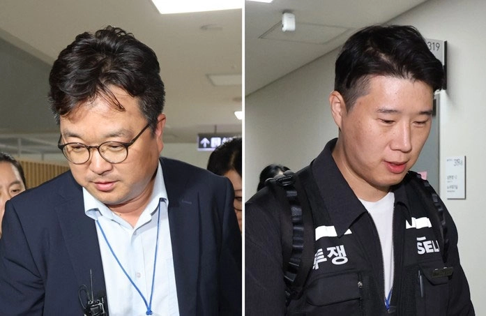 삼성전자 측 대표 교섭위원인 김형로(왼쪽 사진) 부사장과 최승호 초기업노조 삼성전자지부 위원장이 13일 새벽 정부세종청사 중앙노동위원회에서 가진 2026년 임금협약 체결을 위한 2차 사후조정 회의가 결렬된 이후 협상장을 떠나고 있다. 세종 연합뉴스