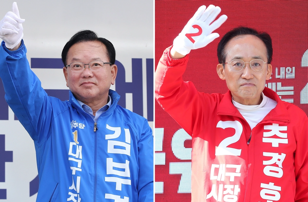김부겸(왼쪽) 더불어민주당 대구시장 후보와 추경호 국민의힘 대구시장 후보.  뉴스1