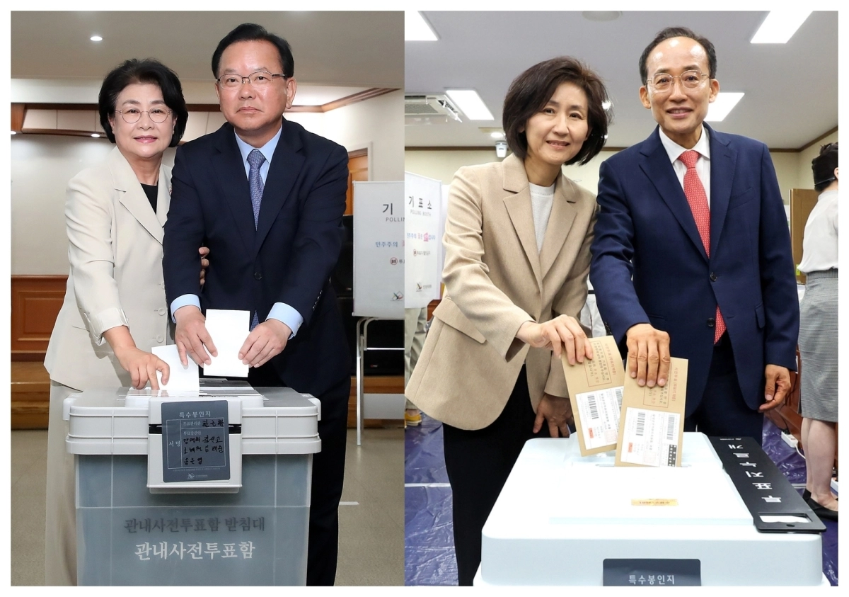 김부겸 더불어민주당 대구시장 후보(오른쪽)와 부인 이유미 씨가 29일 오전 대구 수성구 고산2동 행정복지센터에 마련된 사전투표소에서 투표하고 있다. 같은 날 추경호 국민의힘 대구시장 후보(오른쪽)와 배우자 김희경 씨도 대구 수성구 수성구의회에 마련된 범어1동 사전투표소에서 투표를 마쳤다.  2026.5.29. 뉴스1