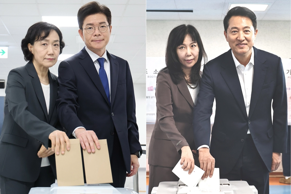 정원오(왼쪽) 더불어민주당 서울시장 후보 내외와 오세훈 국민의힘 서울시장 후보 내외가 29일 서울 중구 소공동행정복합청사에 마련된 사전투표소와 용산구 한남동 주민센터에 마련된 사전투표소에서 각각 소중한 한표를 행사하고 있다. (2026.05.29. 뉴시스