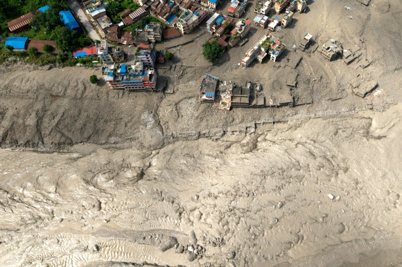 A drone view shows mud covering properties following a flash flood at Trishuli, Nepal